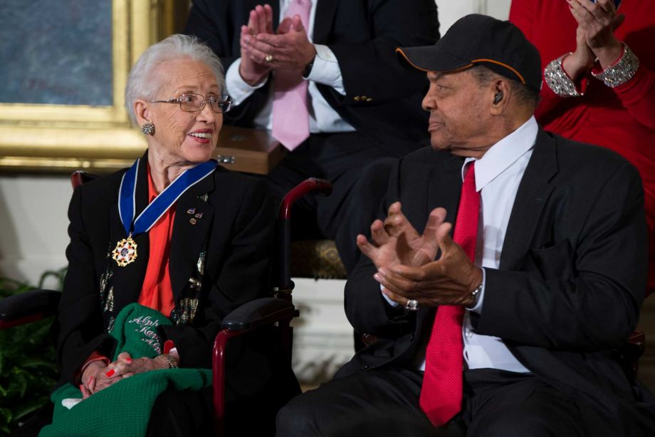 Willie Mays applauds NASA mathematician Katherine Johnson after she received the Presidential Medal of Freedom from President Barack Obama during a ceremony at the White House on Tuesday. Obama recognized 17 Americans with the nation's highest civilian