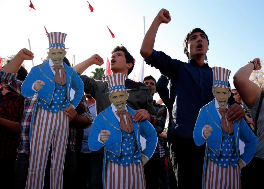 Members of the Turkey Youth Union hold effigies of U.S. President Barack Obama during a protest in Antalya Turkey Sunday Nov. 15 2015. The 2015 G-20 Leaders Summit will be held near the Turkish Mediterranean coastal city of Antalya on Nov. 15-16 201