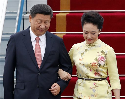 China's President Xi Jinping and his wife Peng Liyuan arrive at Noi Bai International Airport in Hanoi Vietnam Thursday Nov. 5 2015. Xi's visit to Vietnam on Thursday comes as the two communist countries seek to mend ties strained over territorial dis