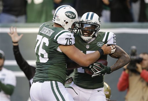 New York Jets wide receiver Brandon Marshall celebrates with New York Jets center Wesley Johnson after scoring a touchdown against Jacksonville Jaguars during the fourth quarter of an NFL football game Sunday Nov. 8 2015 in East Rutherford