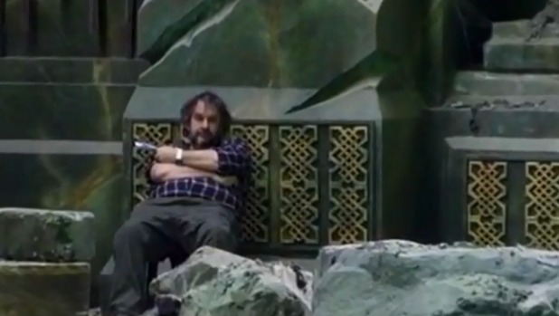 A still from the new video shows an apparently exhausted Sir Peter Jackson on set