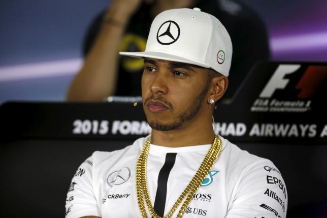 Mercedes Formula One driver Hamilton listens to journalist during driver's news conference at the Yas Marina circuit before the start of the Abu Dhabi Grand Prix