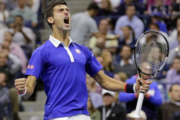 Federer eliminated by big-serving Isner in Paris