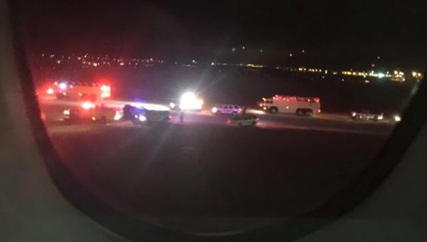 Emergency personnel are shown on the tarmac at Salt Lake City International Airport in this