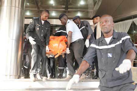 ANOTHER TERROR ATTACK Officers evacuate bodies of victims from the Radisson Blu hotel in Bamako on Friday after the assault of security forces. Malian forces backed by French troops stormed the Radisson Blu hotel in the capital Bamako after suspected Is