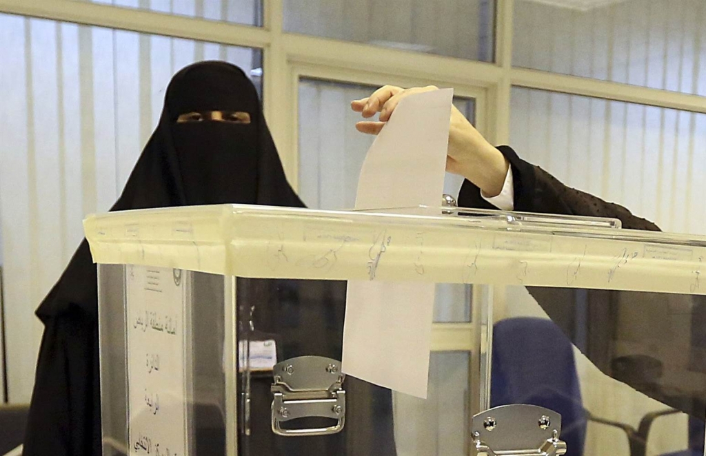 Image A Saudi woman votes at a polling center during the municipal elections