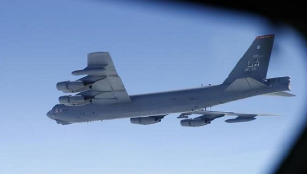 A U.S. Air Force B-52 is seen through the window of another during a training mission in the United Kingdom