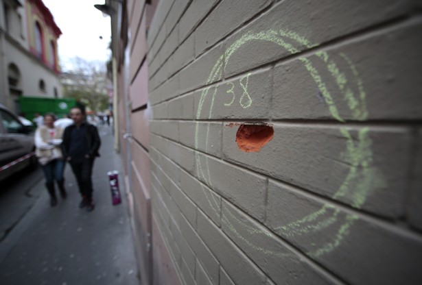 A bullet impact that has been circled in chalk by police on a wall near the Bataclan concert hall in Paris.         
                     Eric Gaillard  Reuters