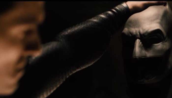 A clip from the teaser trailer for Batman v Superman shows Superman grasping the mask of Batman