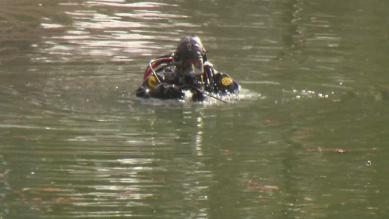 A diver searches a lake in San Bernardino on Dec. 11 2015 as part of the investigation into the massacre at the Inland Regional Center