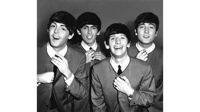 A group portrait of the Beatles straightening their ties backstage at the Odeon Cinema in Luton on Sept. 6th 1963