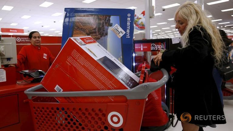 A shopper pays for her purchases during Black Friday shopping at a Target store in Chicago Illinois USA.
   
 

  Enlarge  Caption