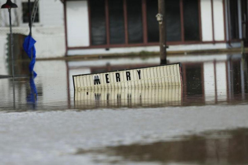 A sign sits underwater located in the downtown area of Elba Alabama