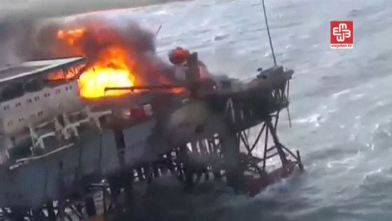 A still image from a video footage shows an oil platform on fire in the Caspian Sea Azerbaijan