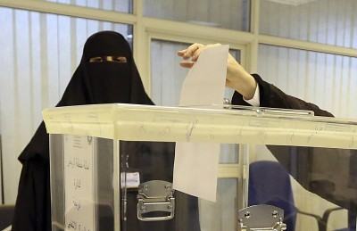 A woman votes at a polling center during municipal elections the first in which women could vote in Riyadh Saudi Arabia