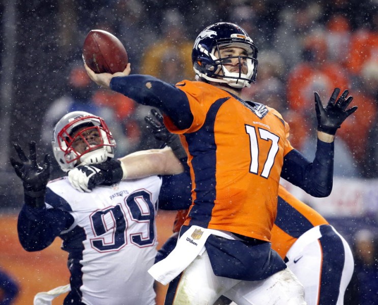 Denver Broncos quarterback Brock Osweiler throws against the New England Patriots during the second half of an NFL football game Sunday Nov. 29 2015 in Denver. The Broncos won 30-24