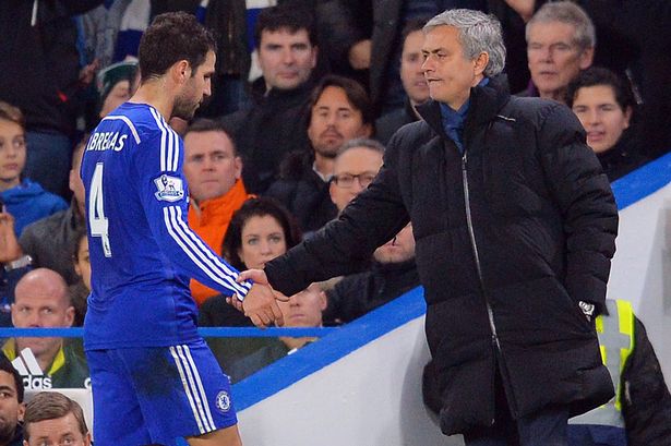 Jose Mourinho shakes hands with Cesc Fabregas after he is substituted during the match between Chelsea and Tottenham at Stamford Bridge