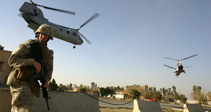 US marine ducks as CH-46 Sea Knight helicopters take off from Ramadi. file