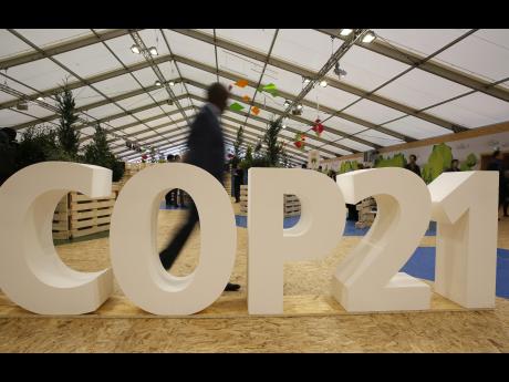 AP     A man visits the Climate Generations Areas part of COP21 the United Nations Climate Change Conference yesterday