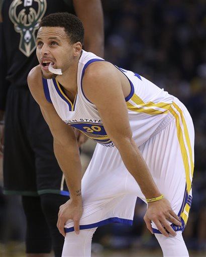 Stephen Curry performs a magic backward flip to Klay Thompson