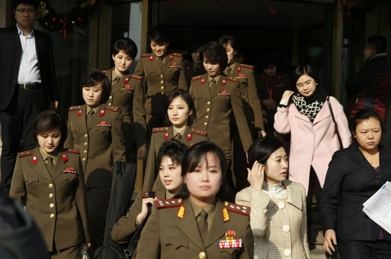 AFP  STRMembers from North Korea's Moranbong band walk out of their hotel in Beijing