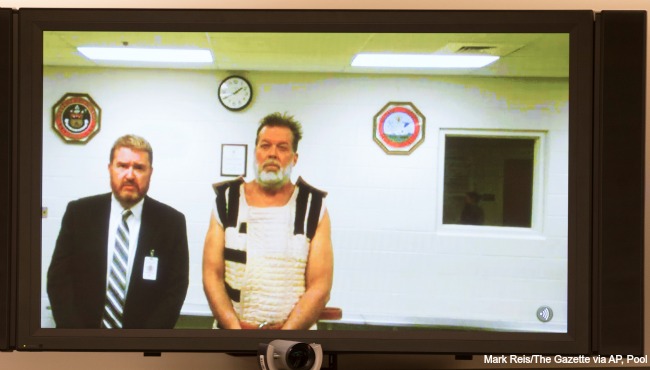 Colorado Springs Planned Parenthood shooting suspect Robert Dear right appears via video hearing during his first court appearance Nov. 30 2015