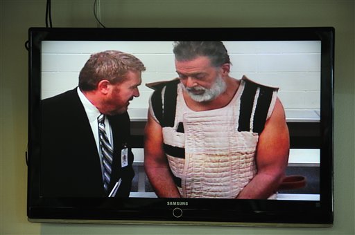 Colorado Springs shooting suspect Robert Dear right appears via video before Judge Gilbert Martinez with public defender Dan King at the El Paso County Criminal Justice Center for this first court appeara