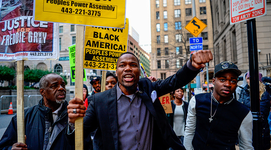 Activist Wesley West leads a protest in front of the courthouse in Baltimore