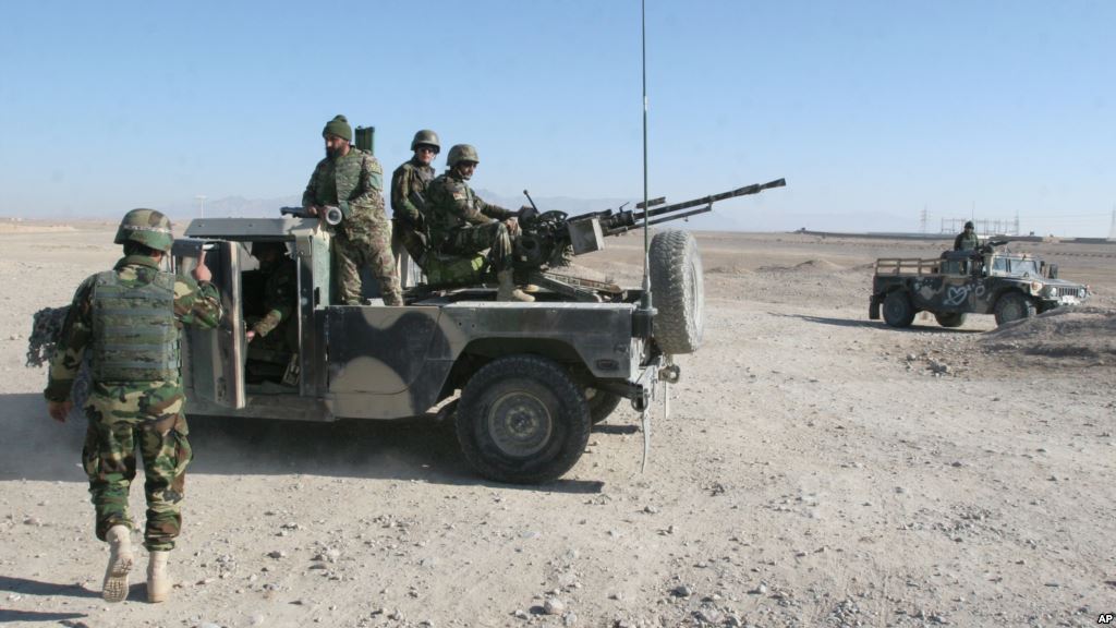 Afghan National Army soldiers guard at a checkpoint on the way to the Sangin district of Helmand province Afghanistan Wednesday Dec. 23 2015