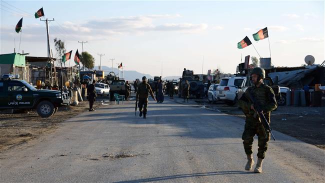 Afghan National Army soldiers stand alert after clashes against security forces at Kandahar Airport