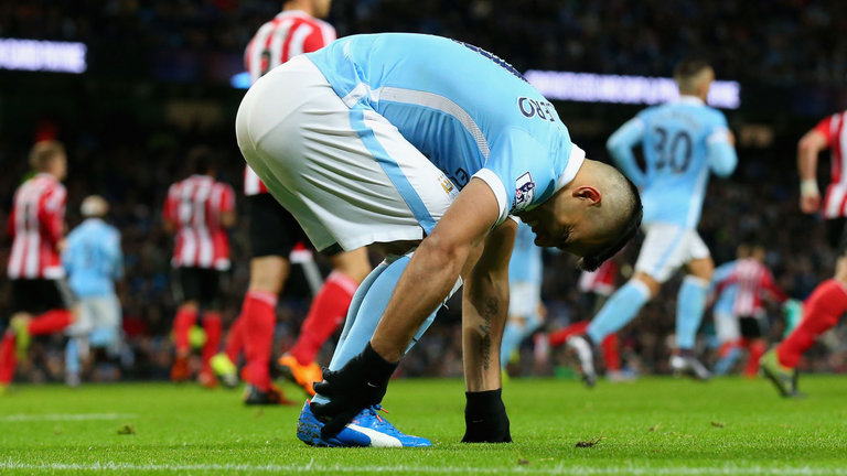 Aguero feels his ankle before being substituted