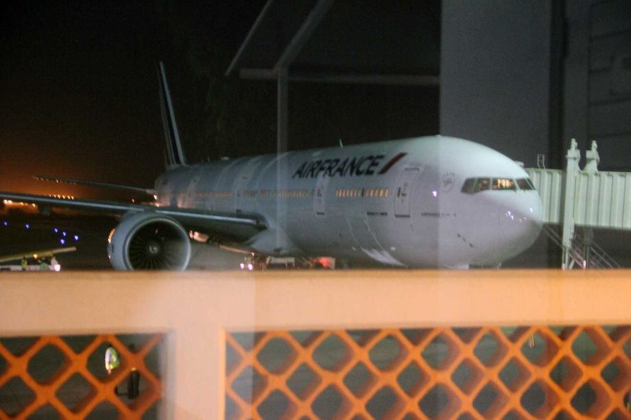 An Air France plane which arrived at Moi International Airport Mombasa Kenya Sunday Dec. 20 2015 to pick passengers after a bomb scare on their earlier flight from Mauritius