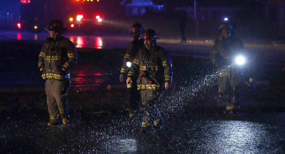 Birmingham firefighters work a scene after a tornado touched down in Jefferson County Ala. damaging several houses Friday Dec. 25 2015