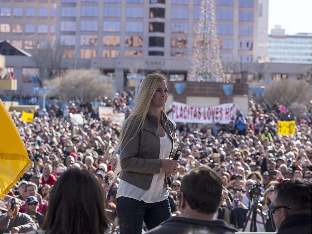 Holly Holm addresses a crowd of fans after a parade for UFC women's bantamweight champion in her native Albuquerque N.M. Sunday Dec. 6 2015. Holm captured the belt from the previously undefeated Ronda Rousey on Nov. 14 in Australia