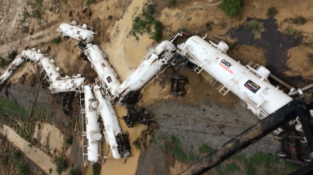 An Aurizon freight train lies beside the tracks after derailing near Julia Creek in Queensland's north-west