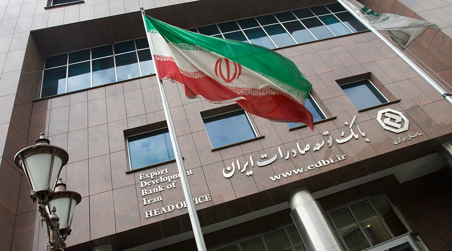 An Iranian flag flutters in front of the head office of the Export Development Bank of Iran in Tehran