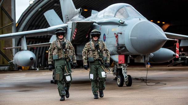 An aircrew with their Tornado GR4 at RAF Marham as they prepare for a practice mission