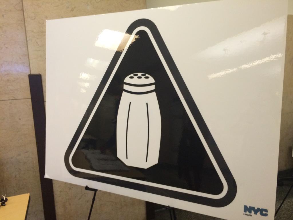 An image of a salt shaker that will appear on menus warning of high salt content