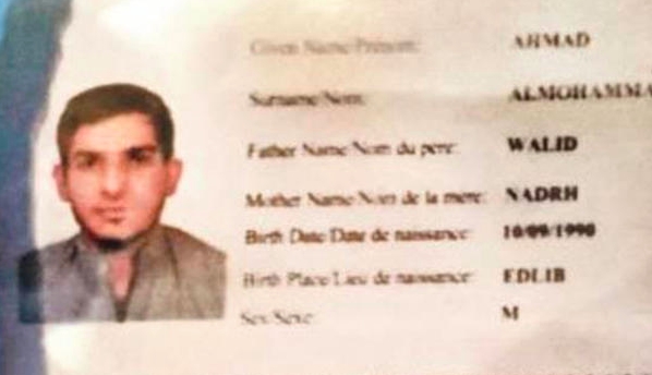 An image of the Syrian passport found at the Stade de France after the bombings there