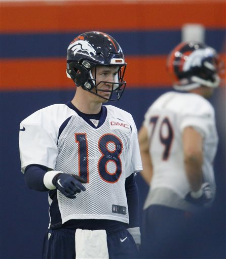 Denver Broncos quarterback Peyton Manning warms up during a practice at the team's headquarters Wednesday Dec.16 2015 in Englewood Colo