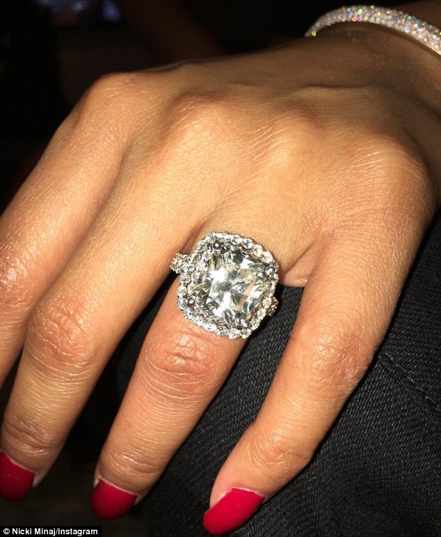 Are they engaged? Nicki Minaj showed off a stunning cushion cut diamond ring on her wedding finger on Wednesday given to her by boyfriend Meek Mill