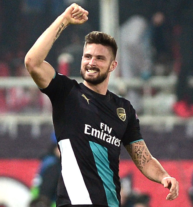 Arsenal's French forward Olivier Giroud celebrates scoring during the UEFA Champions League Group F football match between Olympiacos and Arsenal at the Georgios Karaiskakis Stadium in Piraeus. Pic  AFP