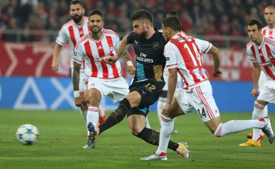 Arsenal's Olivier Giroud scores during a Champions League Group F soccer match between Olympiakos and Arsenal at the Georgios Karaiskakis stadium in Piraeus port near Athens Wednesday Dec. 9 2015