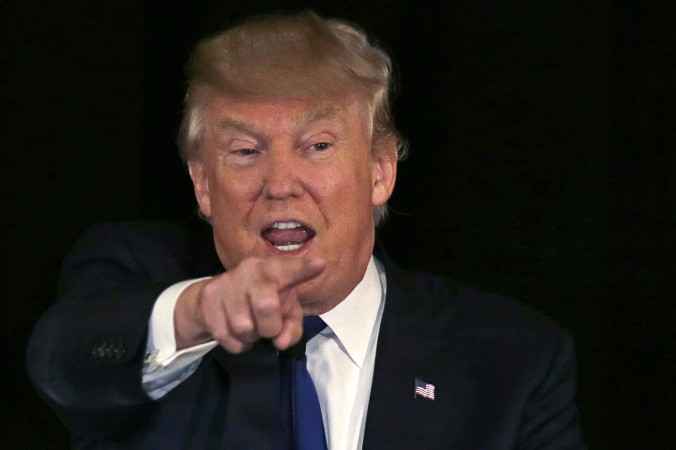 Republican presidential candidate businessman Donald Trump gestures during an address at a regional police union meeting in Portsmouth N.H