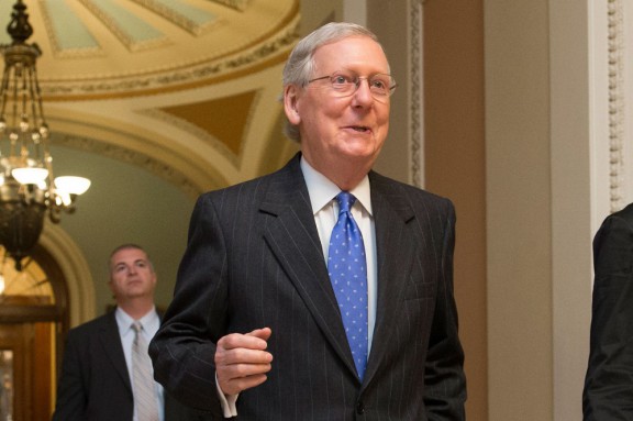 Senate Majority Leader Mitch Mc Connell leaves the Senate chamber after Thursday night’s vote