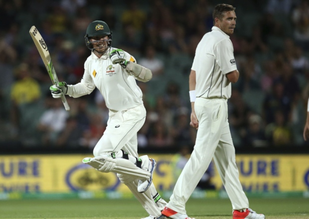 Australia's Peter Siddle left celebrates hitting the winning runs as he passes New Zealand's Tim Southee