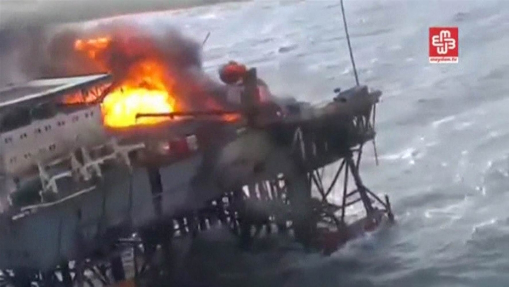 Image A still image from a video footage shows an oil platform on fire in the Caspian Sea