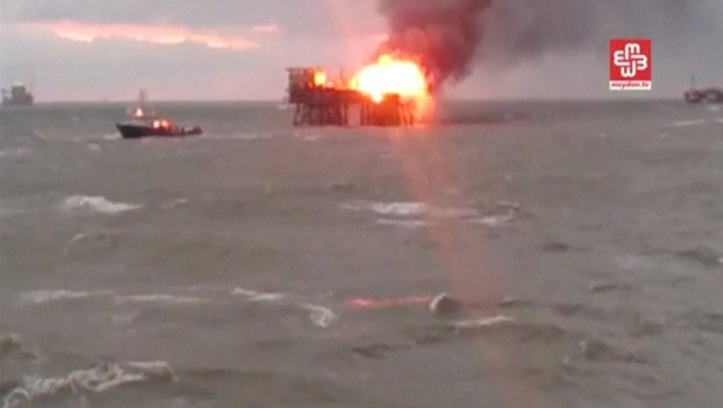 A still image from a video footage shows an oil platform on fire in the Caspian Sea Azerbaijan yesterday. The Azeri oil platform caught fire during high winds in the Caspian Sea. – Reuters pic