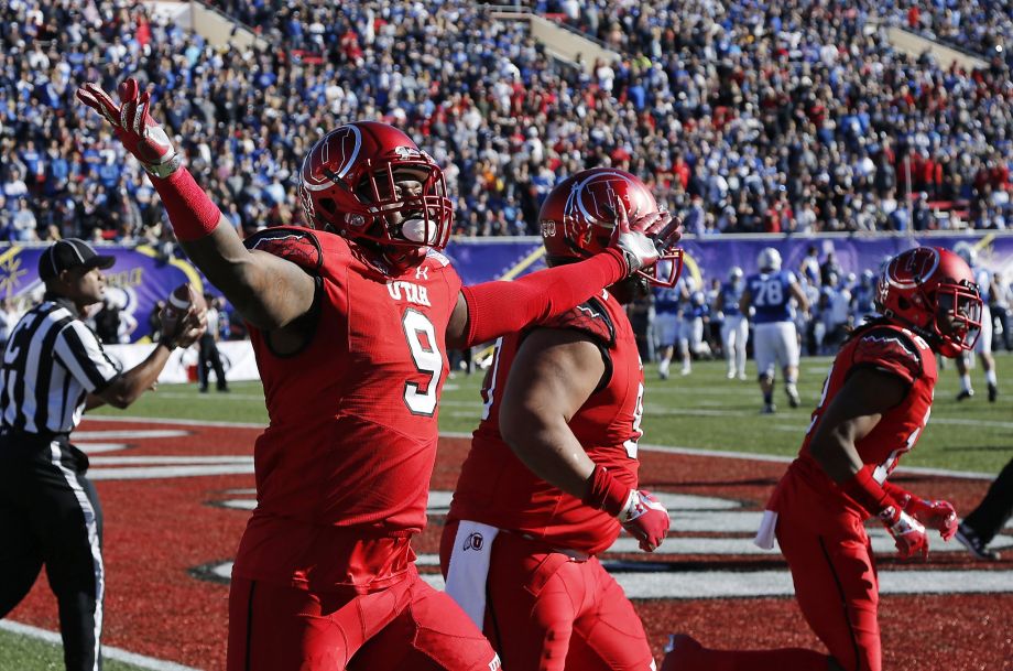 Utah defensive back Tevin Carter celebrates after scoring a TD on one of his two interceptions