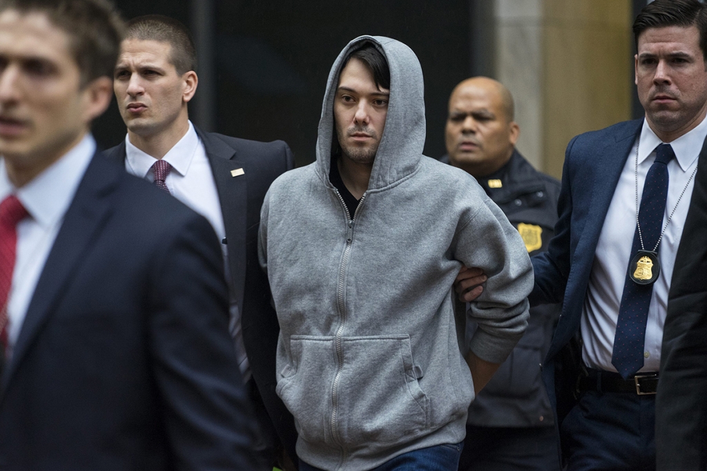 Martin Shkreli the former hedge fund manager under fire for buying a pharmaceutical company and ratcheting up the price of a life-saving drug is escorted by law enforcement agents in New York